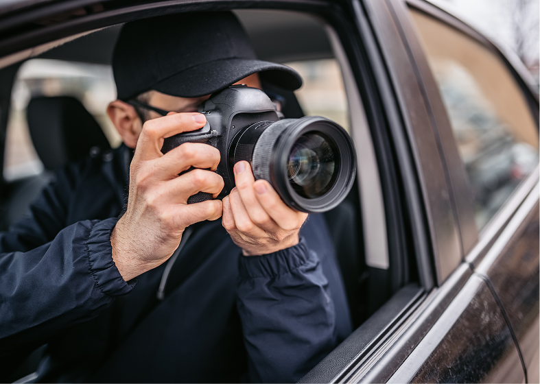 Photographer taking pictures from vehicle