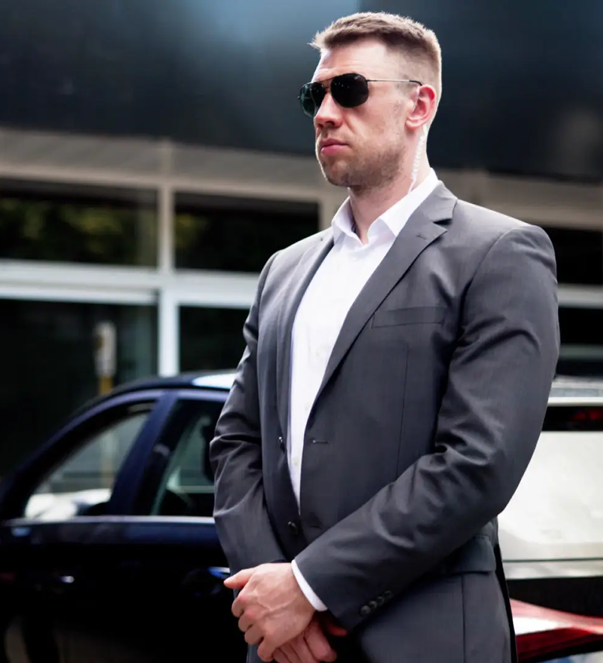Businessman in a gray suit and sunglasses